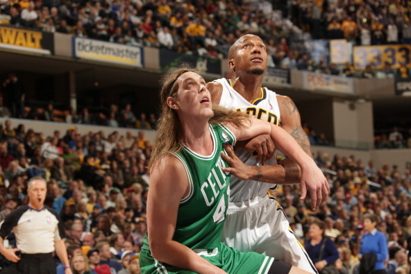 INDIANAPOLIS - DECEMBER 22:  David West #21 of the Indiana Pacers fights for position against Kelly Olynyk #41 of the Boston Celtics on December 22, 2013 in Indianapolis, Indiana at Bankers Life Fieldhouse.  NOTE TO USER: User expressly acknowledges and a