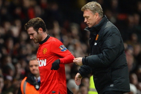 MANCHESTER, ENGLAND - JANUARY 28:  Manchester United Manager David Moyes substitutes Juan Mata during the Barclays Premier League match between Manchester United and Cardiff City at Old Trafford on January 28, 2014 in Manchester, England.  (Photo by Micha