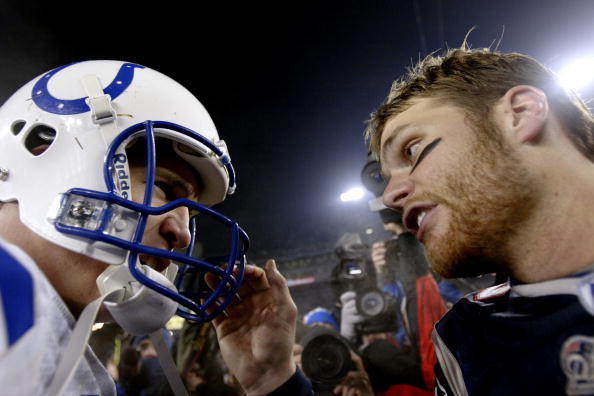 FOXBORO, MA - JANUARY 18:  Quarterback Tom Brady #12 of the New England Patriots and quarterback Peyton Manning #18 of the Indianapolis Colts greet each other on the field after the AFC Championship Game on January 18, 2004 at Gillette Stadium in Foxboro,