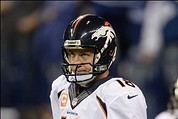 Oct 20, 2013; Indianapolis, IN, USA; Denver Broncos quarterback Peyton Manning (18) reacts to a turnover under review during the first quarter against the Indianapolis Colts at Lucas Oil Stadium. Mandatory Credit: Ron Chenoy-USA TODAY Sports