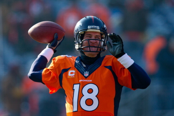 DENVER, CO - DECEMBER 8:  Quarterback Peyton Manning #18 of the Denver Broncos warms up on the field before taking on the Tennessee Titans at Sports Authority Field on December 8, 2013 in Denver, Colorado. (Photo by Justin Edmonds/Getty Images)