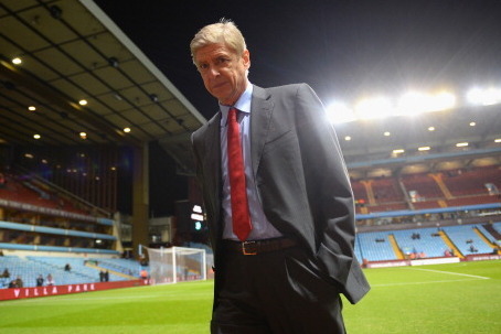 BIRMINGHAM, ENGLAND - JANUARY 13: Manager Arsene Wenger of Arsenal walks pitchside ahead of the Barclays Premier League match between Aston Villa and Arsenal at Villa Park on January 13, 2014 in Birmingham, England.  (Photo by Michael Regan/Getty Images)