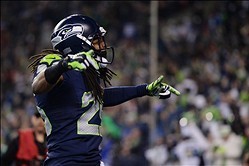 Jan 19, 2014; Seattle, WA, USA; Seattle Seahawks cornerback Richard Sherman (25) celebrates after outside linebacker Malcolm Smith (not pictured) intercepted the ball during the fourth quarter of the 2013 NFC Championship football game against the San Fra