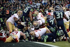 Jan 19, 2014; Seattle, WA, USA; San Francisco 49ers running back Anthony Dixon (24) is stopped short of the goal line by the Seattle Seahawks defense on a third down play during the first half of the 2013 NFC Championship football game at CenturyLink Fiel