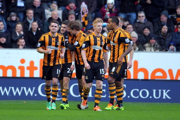 HULL, ENGLAND - FEBRUARY 01: Nikica Jelavic (3rd L) of Hull City congratulates team-mate Shane Long (2nd L) on his debut goal during the Barclays Premier League match between Hull City and Tottenham Hotspur at KC Stadium on February 01, 2014 in Hull, Engl