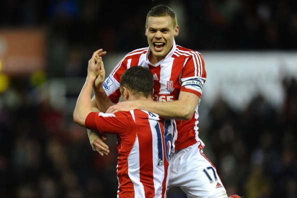 STOKE ON TRENT, ENGLAND - FEBRUARY 01: Ryan Shawcross of Stoke City celebrates victory with Charlie Adam during the Barclays premier League match between Stoke City and Manchester United at Britannia Stadium on February 1, 2014 in Stoke on Trent, England.