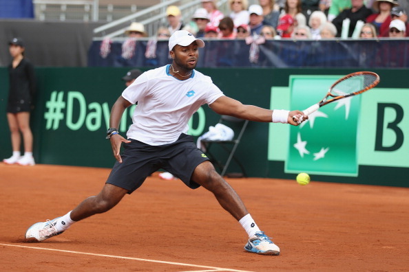 SAN DIEGO, CA - JANUARY 31:  Donald Young of the United States stretches to play a forehand against Andy Murray of  Great Britain during day one of the Davis Cup World Group first round between the U.S. and Great Britain at PETCO Park on January 31, 2014 