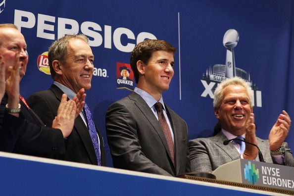 NEW YORK, NY - JANUARY 30: New York Giants Football player Eli Manning rings the Closing Bell on the floor of the New York Stock Exchange on January 30, 2014 in New York City. The Dow rose more than 100 points following news of strong corporate earnings f