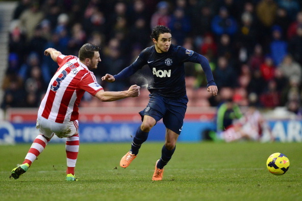 STOKE ON TRENT, ENGLAND - FEBRUARY 01: Rafael of Manchester United goes past Erik Pieters of Stoke City during the Barclays Premier League match between Stoke City and Manchester United at Britannia Stadium on February 1, 2014 in Stoke on Trent, England. 