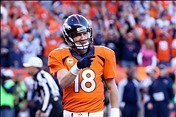 Jan 19, 2014; Denver, CO, USA; Denver Broncos quarterback Peyton Manning (18) celebrates during the 2013 AFC championship playoff football game against the New England Patriots at Sports Authority Field at Mile High. Mandatory Credit: Matthew Emmons-USA T