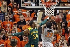 Feb 1, 2014; Stillwater, OK, USA;  Oklahoma State Cowboys guard Marcus Smart (33) drives on Baylor Bears forward Cory Jefferson (34) in the first half at Gallagher-Iba Arena. Mandatory Credit: Tim Heitman-USA TODAY Sports