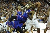 Feb 1, 2014; Austin, TX, USA; Kansas Jayhawks center Joel Embiid (21) gets tangled with Texas Longhorns center Cameron Ridley (behind) during the first half at the Frank Erwin Special Events Center. Mandatory Credit: Brendan Maloney-USA TODAY Sports
