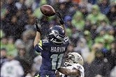Jan 11, 2014; Seattle, WA, USA; Seattle Seahawks wide receiver Percy Harvin (11) catches a pass against New Orleans Saints cornerback Corey White (24) during the first half of the 2013 NFC divisional playoff football game at CenturyLink Field. Mandatory C