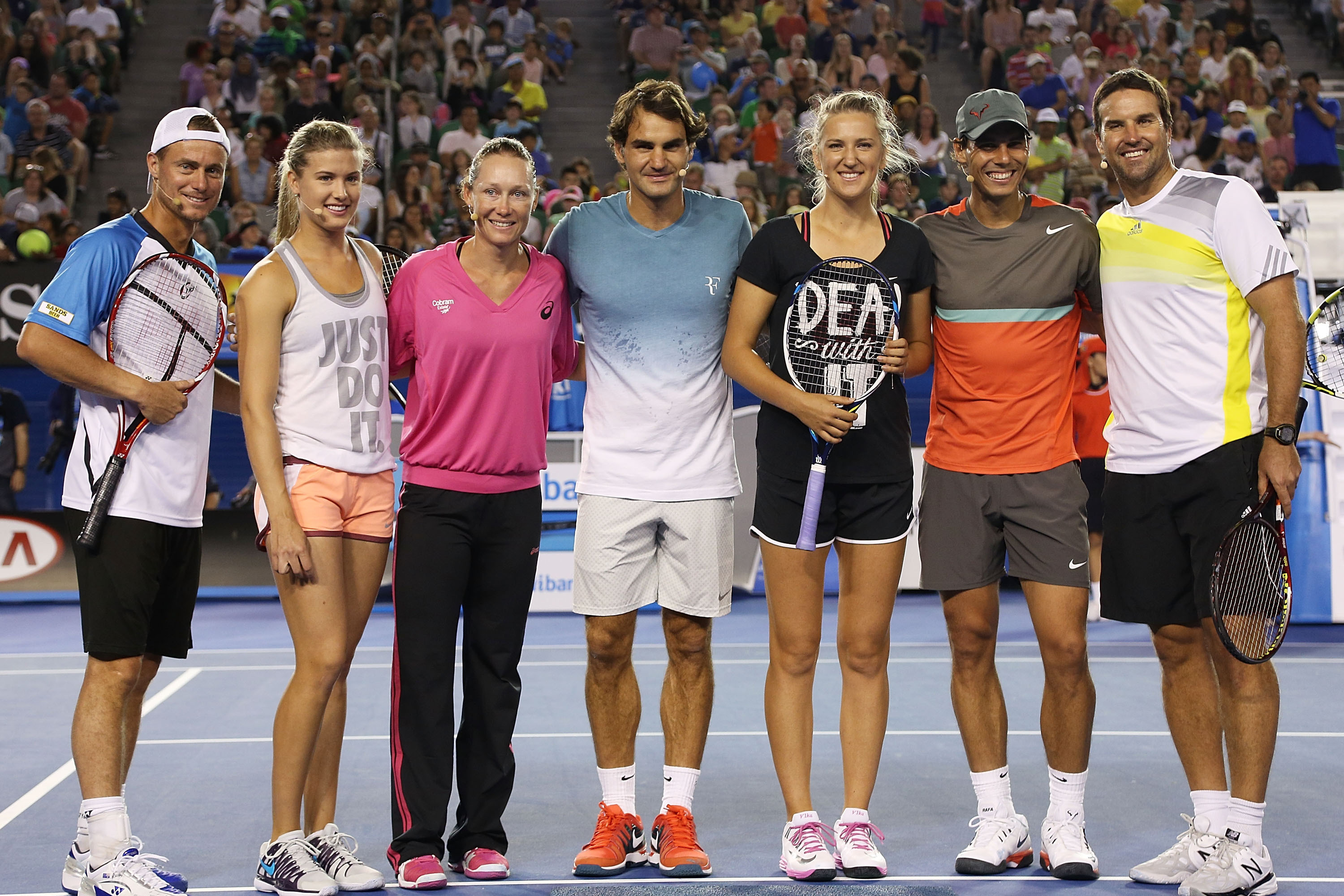 MELBOURNE, AUSTRALIA - JANUARY 11:  (L-R) Lleyton Hewitt, Eugenie Bouchard, Samantha Stosur, Roger Federer, Victoria Azarenka, Rafael Nadal and Pat Rafter pose following the Rod Laver Arena Spectacular as part of Kids Tennis Day ahead of the 2014 Australi