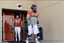 Jul 27, 2013; Englewood, CO, USA; Denver Broncos defensive tackle Sylvester Williams (92) and defensive tackle Mitch Unrein (96) walk towards the field before the start of training camp at the Broncos training facility. Mandatory Credit: Ron Chenoy-USA TO