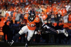 Jan 19, 2014; Denver, CO, USA; Denver Broncos running back Montee Ball (28) is pursued by New England Patriots defensive lineman Rob Ninkovich (50) during the 2013 AFC Championship football game at Sports Authority Field at Mile High. Mandatory Credit: Ma