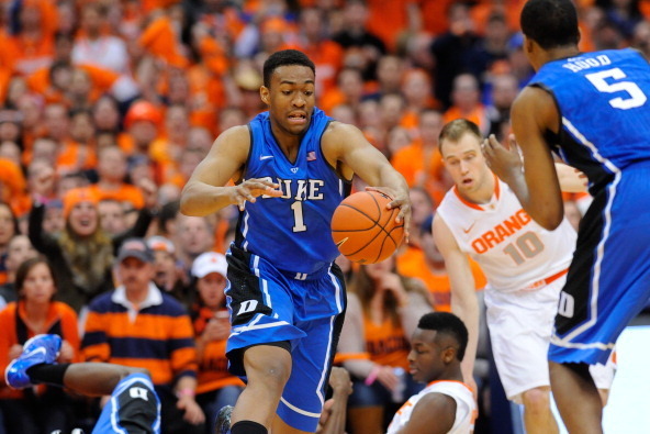 SYRACUSE, NY - FEBRUARY 01:  Jabari Parker #1 of the Duke Blue Devils reaches for a loose ball against the Syracuse Orange during the first half at the Carrier Dome on February 1, 2014 in Syracuse, New York.  (Photo by Rich Barnes/Getty Images)
