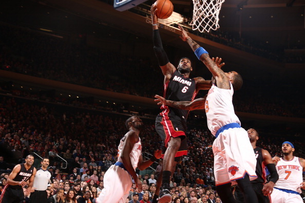 NEW YORK, NY - FEBRUARY 01: LeBron James #6 of the Miami Heat shoots against J.R. Smith #8 of the New York Knicks during a game at Madison Square Garden in New York City on February 01, 2014.  NOTE TO USER: User expressly acknowledges and agrees that, by 