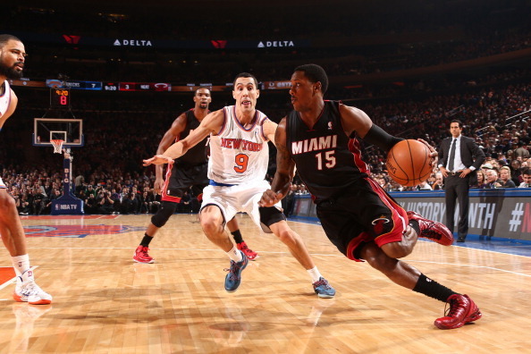 NEW YORK, NY - FEBRUARY 01: Mario Chalmers #15 of the Miami Heat drives against Pablo Prigioni #9 of the New York Knicks during a game at Madison Square Garden in New York City on February 01, 2014.  NOTE TO USER: User expressly acknowledges and agrees th
