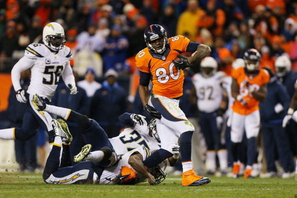 DENVER, CO - JANUARY 12:  Julius Thomas #80 of the Denver Broncos gains 17 yards for a first down in the fourth quarter against the San Diego Chargers during the AFC Divisional Playoff Game at Sports Authority Field at Mile High on January 12, 2014 in Den