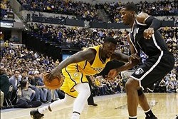 Feb 1, 2014; Indianapolis, IN, USA; Indiana Pacers guard Lance Stephenson (1) drives to the basket against Brooklyn Nets guard Joe Johnson (7) at Bankers Life Fieldhouse. Indiana defeats Brooklyn 97-96. Mandatory Credit: Brian Spurlock-USA TODAY Sports
