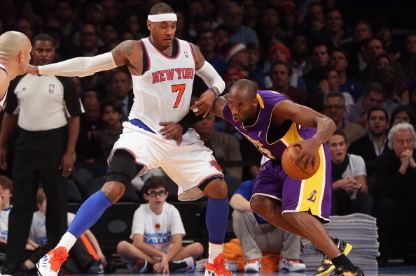 NEW YORK, NY - DECEMBER 13:  Kobe Bryant #24 of the Los Angeles Lakers plays against Carmelo Anthony #7 of the New York Knicks  at Madison Square Garden on December 13, 2012 in New York City. NOTE TO USER: User expressly acknowledges and agrees that, by d