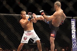 Feb 1, 2014; Newark, NJ, USA; Renan Barao (red gloves) fights Urijah Faber (blue gloves) during UFC 169 at Prudential Center. Mandatory Credit: Joe Camporeale-USA TODAY Sports