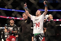 Feb 1, 2014; Newark, NJ, USA; Ali Bagautinov (blue gloves) celebrates beating John Lineker (red gloves) during UFC169 at Prudential Center. Mandatory Credit: Joe Camporeale-USA TODAY Sports