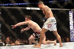 Feb 1, 2014; Newark, NJ, USA; Abel Trujillo (blue gloves) knocks out Jamie Varner (red gloves) during UFC 169 at Prudential Center. Mandatory Credit: Joe Camporeale-USA TODAY Sports