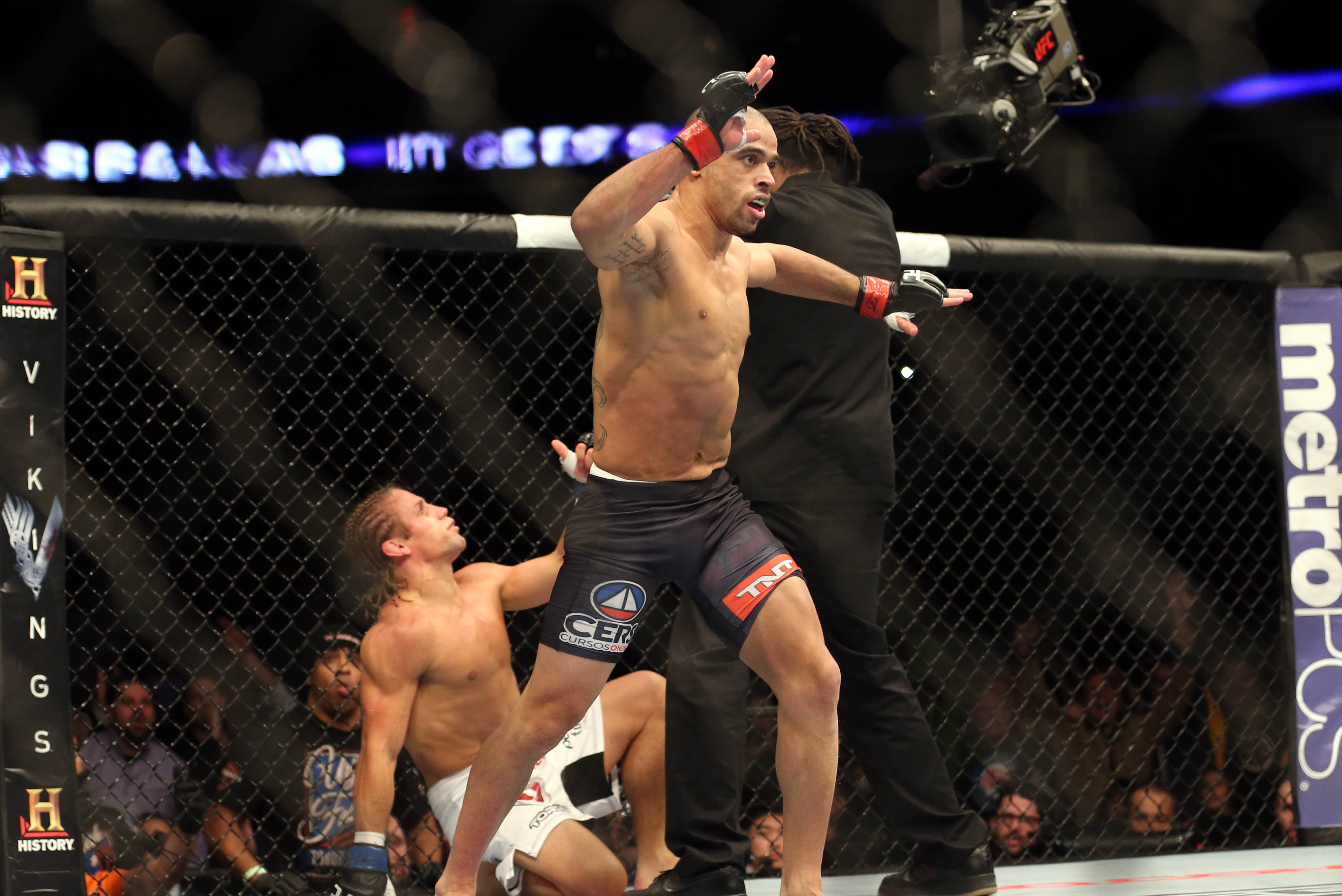 Feb 1, 2014; Newark, NJ, USA; Renan Barao (red gloves) fights Urijah Faber (blue gloves) during UFC 169 at Prudential Center. Mandatory Credit: Joe Camporeale-USA TODAY Sports