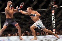 Feb 1, 2014; Newark, NJ, USA; Renan Barao (red gloves) fights Urijah Faber (blue gloves) during UFC 169 at Prudential Center. Mandatory Credit: Joe Camporeale-USA TODAY Sports
