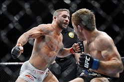 December 14, 2013; Sacramento, CA, USA; Chad Mendes (red gloves) fights Nik Lentz (blue gloves) during the featherweight bout of the UFC on FOX 9 at Sleep Train Arena. Mandatory Credit: Kyle Terada-USA TODAY Sports