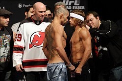 Jan 31, 2014; Newark, NJ, USA; Urijah Faber (right) and Renan Barao (left) face off after weighing in for their Bantamweight Championship bout at Prudential Center. Mandatory Credit: Joe Camporeale-USA TODAY Sports