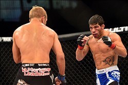 Oct 9, 2013; Barueri, Sao Paulo, Brazil; Raphael Assuncao  (blue shorts) fights against  TJ Dillashaw (black shorts) during UFC Fight Night 29 at Jose Correa Arena. Mandatory Credit: Jason Silva-USA TODAY Sports