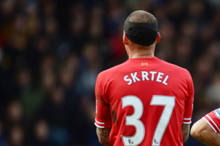 WEST BROMWICH, ENGLAND - FEBRUARY 02:  Luis Suarez (L) speaks with teammate Martin Skrtel of Liverpool during the Barclays Premier League match between West Bromwich Albion and Liverpool at The Hawthorns on February 2, 2014 in West Bromwich, England.  (Ph