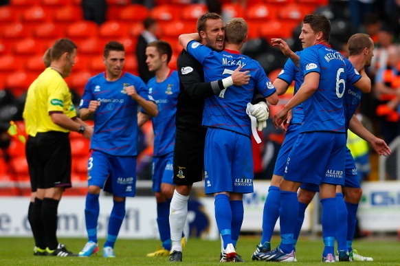 DUNDEE, SCOTLAND - AUGUST 10: Dean Brill (C) of Inverness Caledonian Thistle celebrates with William McKay at full time of the Scottish Premier League match between Dundee United and Inverness Caledonian Thistle at Tannadice Park on August 10, 2013 in Dun