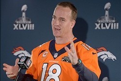 Jan 30, 2014; Jersey City, NJ, USA; Denver Broncos quarterback Peyton Manning (18) at a press conference in advance of Super Bowl XLVIII on the Cornucopia Majesty yacht on the Hudson River. Mandatory Credit: Kirby Lee-USA TODAY Sports