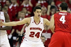 Feb 1, 2014; Madison, WI, USA;  Wisconsin Badgers guard Bronson Koenig (24) defends against Ohio State Buckeyes guard Aaron Craft (4) at the Kohl Center. Ohio State defeated Wisconsin 59-58. Mandatory Credit: Mary Langenfeld-USA TODAY Sports