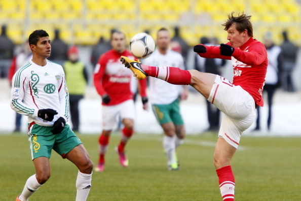 MOSCOW, RUSSIA - MARCH 10: Kim Kallstrom of FC Spartak Moscow is challenged by Ailton of FC Terek Grozny during the Russian Premier League match between FC Spartak Moscow and FC Terek Grozny at the Luzhniki Stadium on March 10, 2013 in Moscow, Russia.  (P