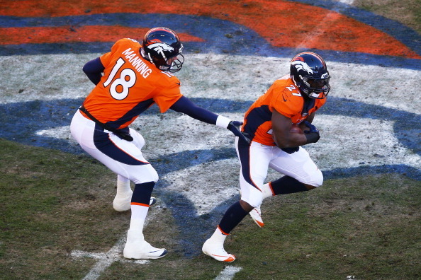 DENVER, CO - JANUARY 12:   Peyton Manning #18 hand the ball off to  Knowshon Moreno #27 of the Denver Broncos in the first quarter against the San Diego Chargers during the AFC Divisional Playoff Game at Sports Authority Field at Mile High on January 12, 