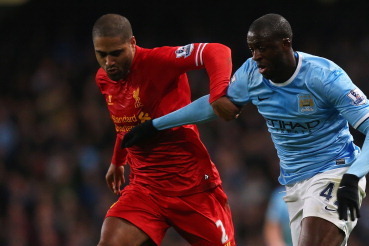 MANCHESTER, ENGLAND - DECEMBER 26:  Yaya Toure of Manchester City is closed down by Glen Johnson of Liverpool during the Barclays Premier League match between Manchester City and Liverpool at Etihad Stadium on December 26, 2013 in Manchester, England.  (P