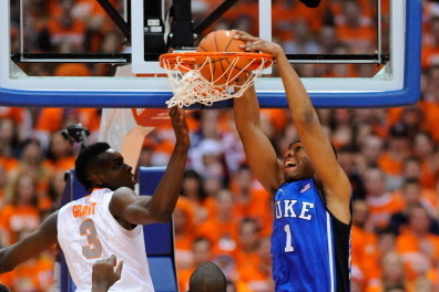 SYRACUSE, NY - FEBRUARY 01:  Jabari Parker #1 of the Duke Blue Devils dunks the ball against Jerami Grant #3 and Baye Moussa Keita #12 of the Syracuse Orange during the first half at the Carrier Dome on February 1, 2014 in Syracuse, New York.  (Photo by R