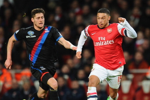 LONDON, ENGLAND - FEBRUARY 02:  Alex Oxlade-Chamberlain of Arsenal gets past Joel Ward of Crystal Palace on his way to scoring his second goal of Crystal Palace during the Barclays Premier League match between Arsenal and Crystal Palace at Emirates Stadiu