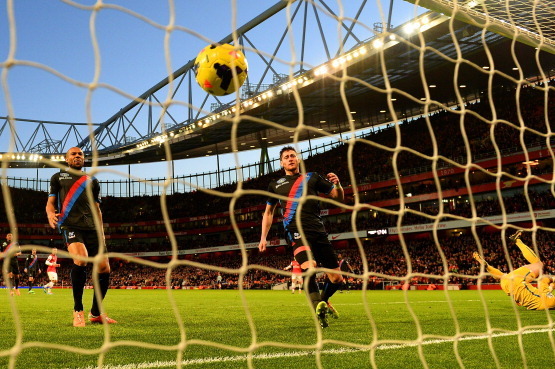 LONDON, ENGLAND - FEBRUARY 02: (L-R)  Danny Gabbidon, Joel Ward and Julian Speroni of Crystal Palace look on as Alex Oxlade-Chamberlain of Arsenal's (not pictured) effort hits the back of the net to score the first goal during the Barclays Premier League 