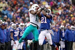 Dec 22, 2013; Orchard Park, NY, USA; Buffalo Bills cornerback Leodis McKelvin (21) jumps to block a pass to Miami Dolphins wide receiver Mike Wallace (11) at Ralph Wilson Stadium. Mandatory Credit: Timothy T. Ludwig-USA TODAY Sports