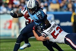 Dec 29, 2013; Nashville, TN, USA; Tennessee Titans running back Chris Johnson (28) carries the ball as Houston Texans linebacker Jeff Tarpinian (52) tackles during the second half at LP Field. The Titans won 16-10. Mandatory Credit: Don McPeak-USA TODAY S
