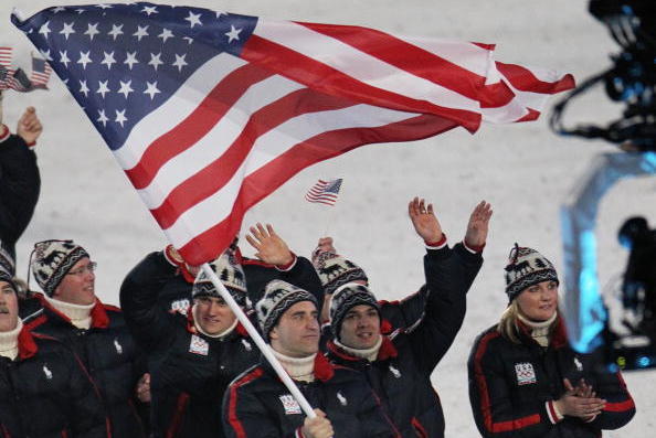 VANCOUVER, BC - FEBRUARY 12:  Mark Grimmette of United States carries the US flag during the Opening Ceremony of the 2010 Vancouver Winter Olympics at BC Place on February 12, 2010 in Vancouver, Canada.  (Photo by Bruce Bennett/Getty Images)