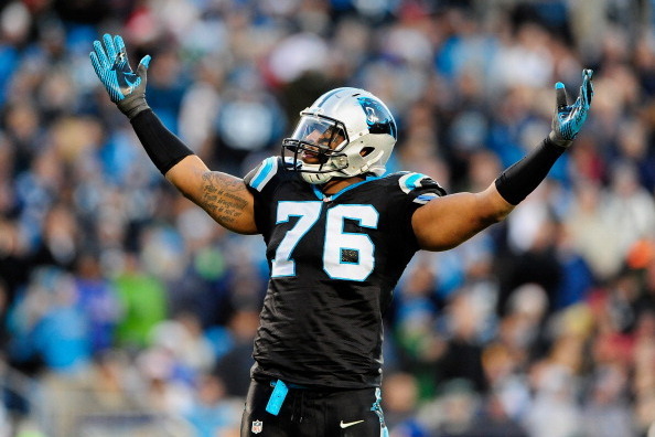 CHARLOTTE, NC - DECEMBER 15:  Greg Hardy #76 of the Carolina Panthers tells the fans to cheer against the New York Jets during play at Bank of America Stadium on December 15, 2013 in Charlotte, North Carolina.  (Photo by Grant Halverson/Getty Images)