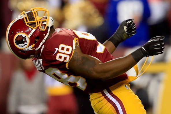 LANDOVER, MD - DECEMBER 01:   Brian Orakpo #98 of the Washington Redskins celebrates after sacking  Eli Manning #10 of the New York Giants in the first quarter during their game at FedExField on December 1, 2013 in Landover, Maryland.  (Photo by Rob Carr/