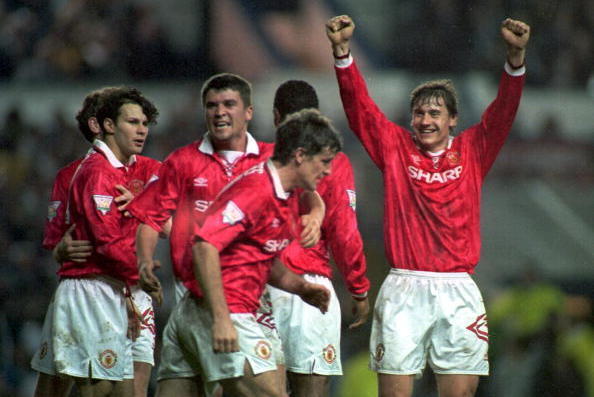 27 APR 1994:  A PICTURE SHOWING RYAN GIGGS OF MANCHESTER UNITED SOCCER CLUB AS HE CELEBRATES WITH ANDREI KANCHELSKIS AND OTHER TEAM-MATES AFTER SCORING HIS SECOND GOAL FOR MANCHESTER UNITED DURING THEIR PREMIER LEAGUE MATCH AGAINST LEEDS Mandatory Credit: